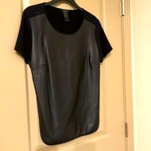 Black leather (imitation) on front & the back is 95% Cotton.